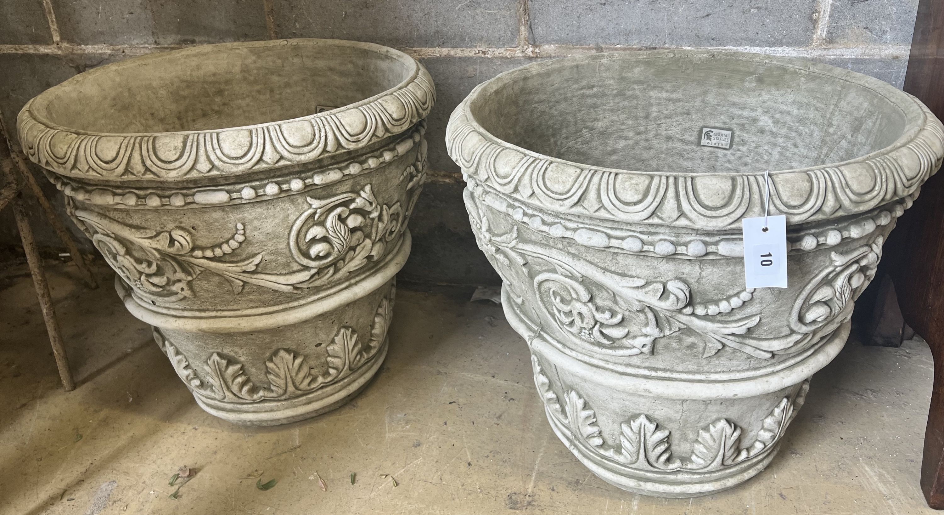 A pair of large reconstituted stone circular garden planters, diameter 55cm height 49cm